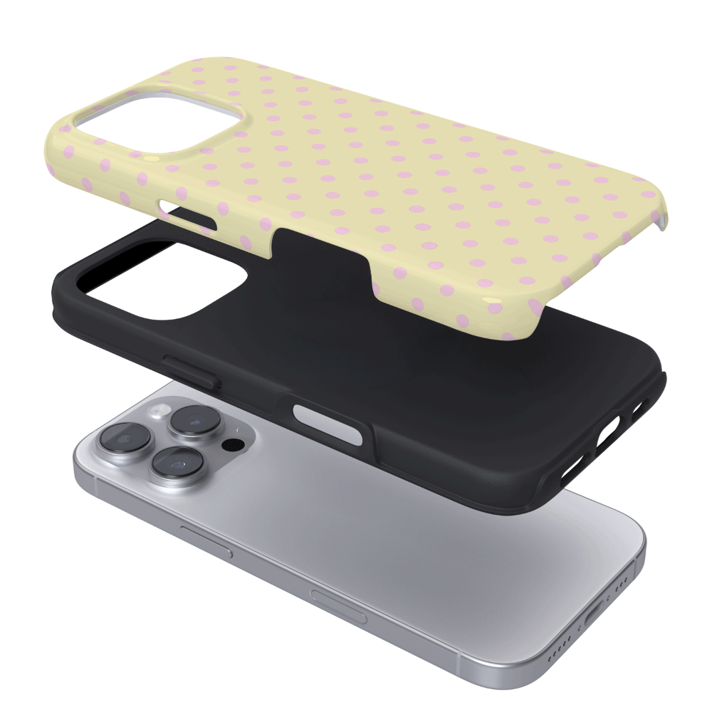 Pale yellow Phone Case mockup with baby pink polka dots. Showing the dual layered design.