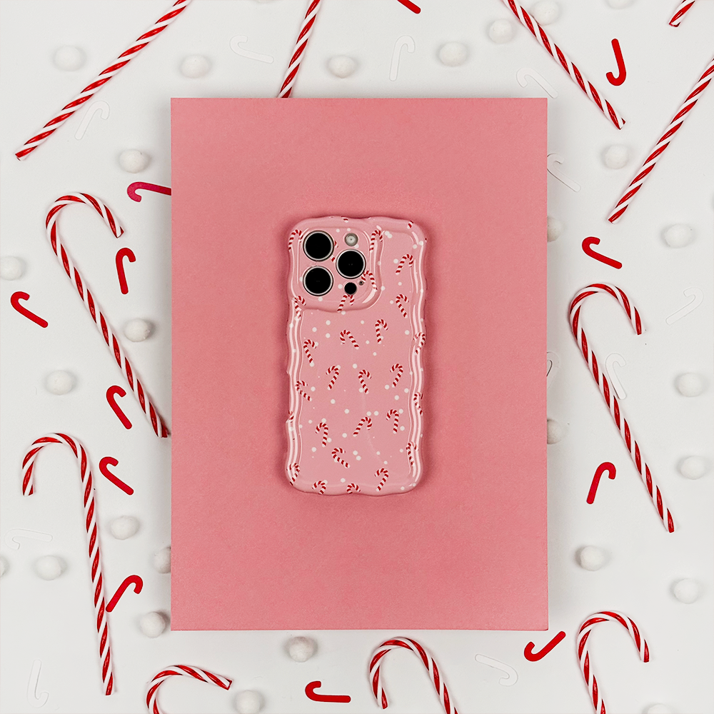 Three images: the left shows a phone with a leopard print case, the center has a tumbler, bag, lip balm, and phone, and the right depicts a phone with a cherry-patterned case, all against a red background.