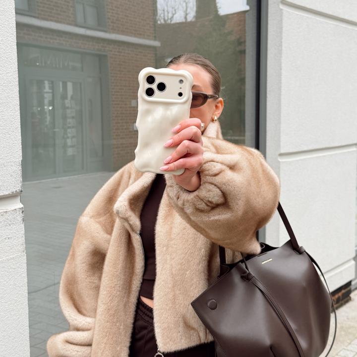 Girl in fur coat taking selfie with the 3D Bubble Cloud Dancer Phone Case