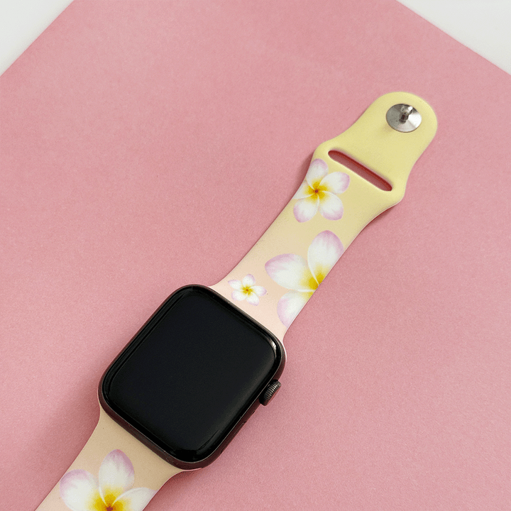 Pink Apple Watch Strap with white flowers.