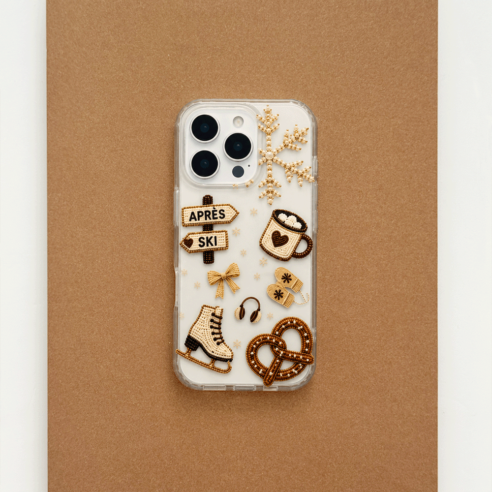 A clear phone case decorated with beige and brown ski-themed graphics, including skis, a pretzel, a coffee cup, a bow, and directional signs reading 'APRÈS' and 'SKI'.