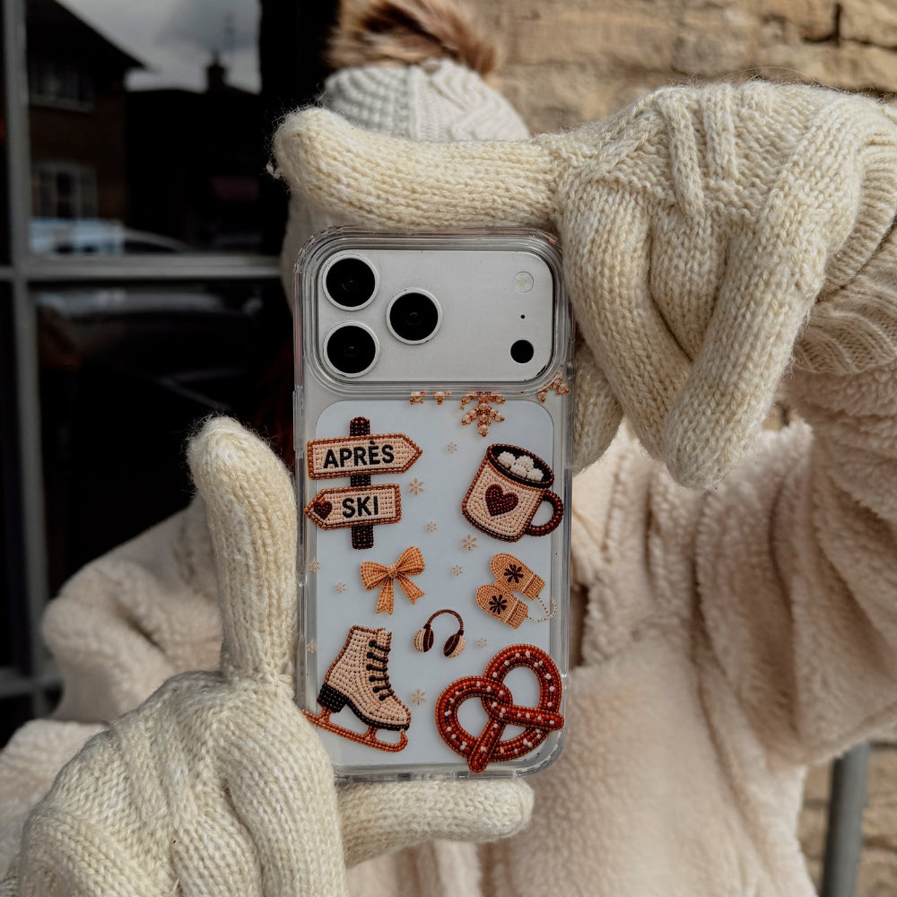 Apres Hour Clear Phone Case building help by a girl in cream gloves, coat and bobble hat