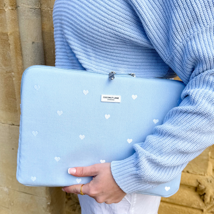 Girl holding her Blue Hearts Laptop Sleeve