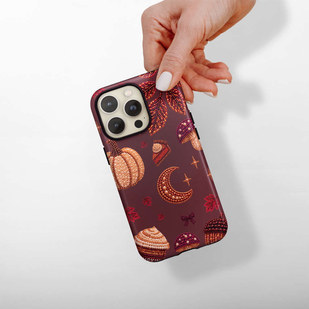 Cute autumnal beaded icons on a warm brown background.