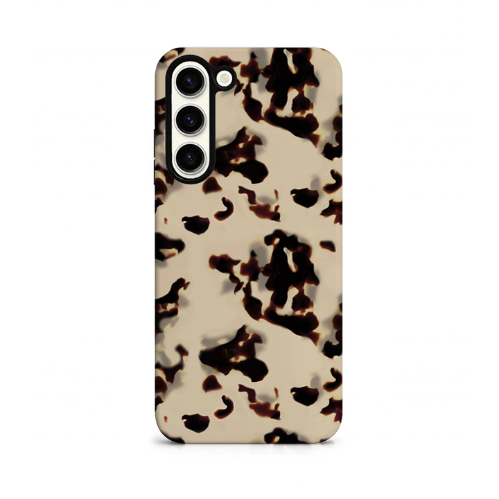 Phone case with a beige and black tort print design on a white background
