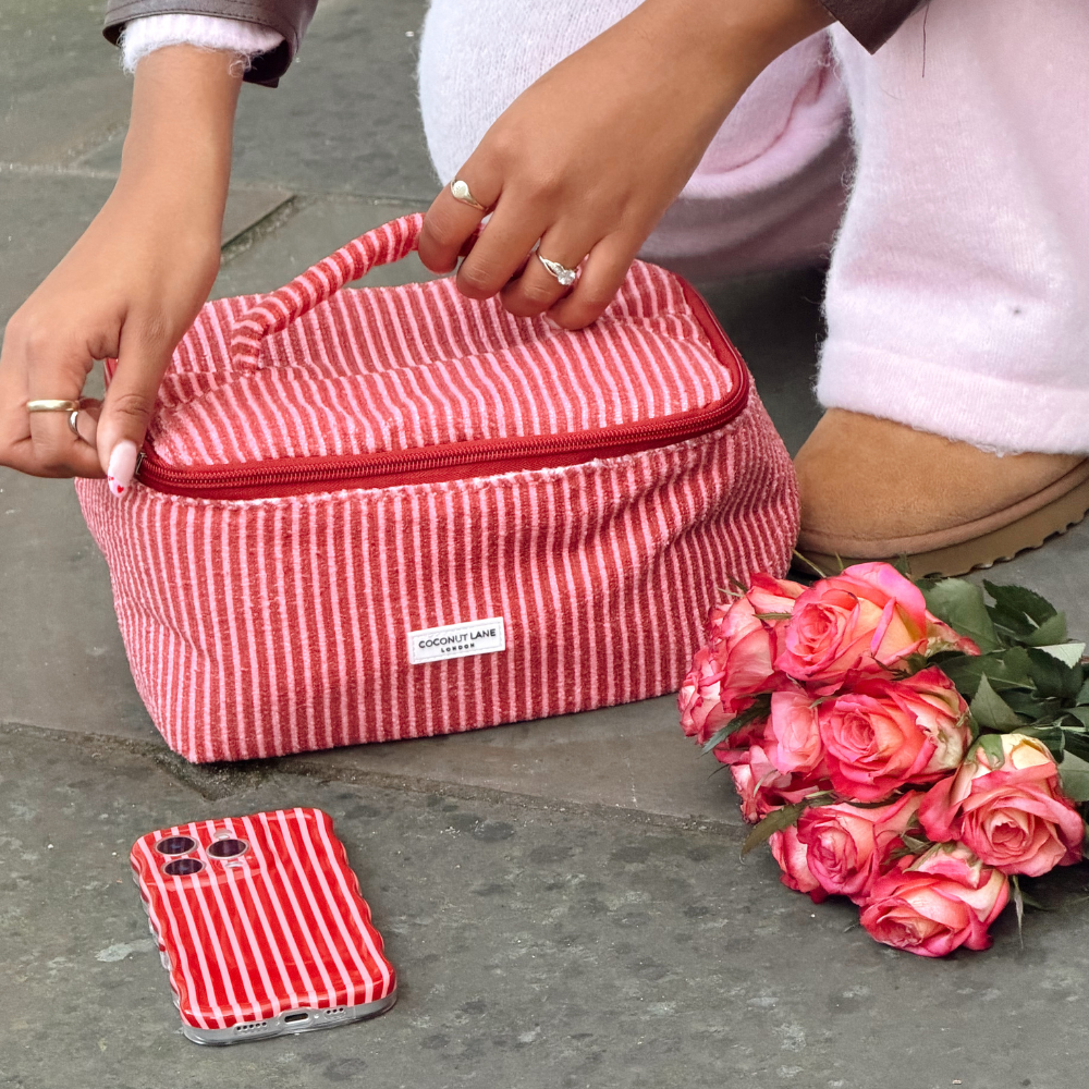 Mulberry Vanity Case with flowers in lifestyle setting