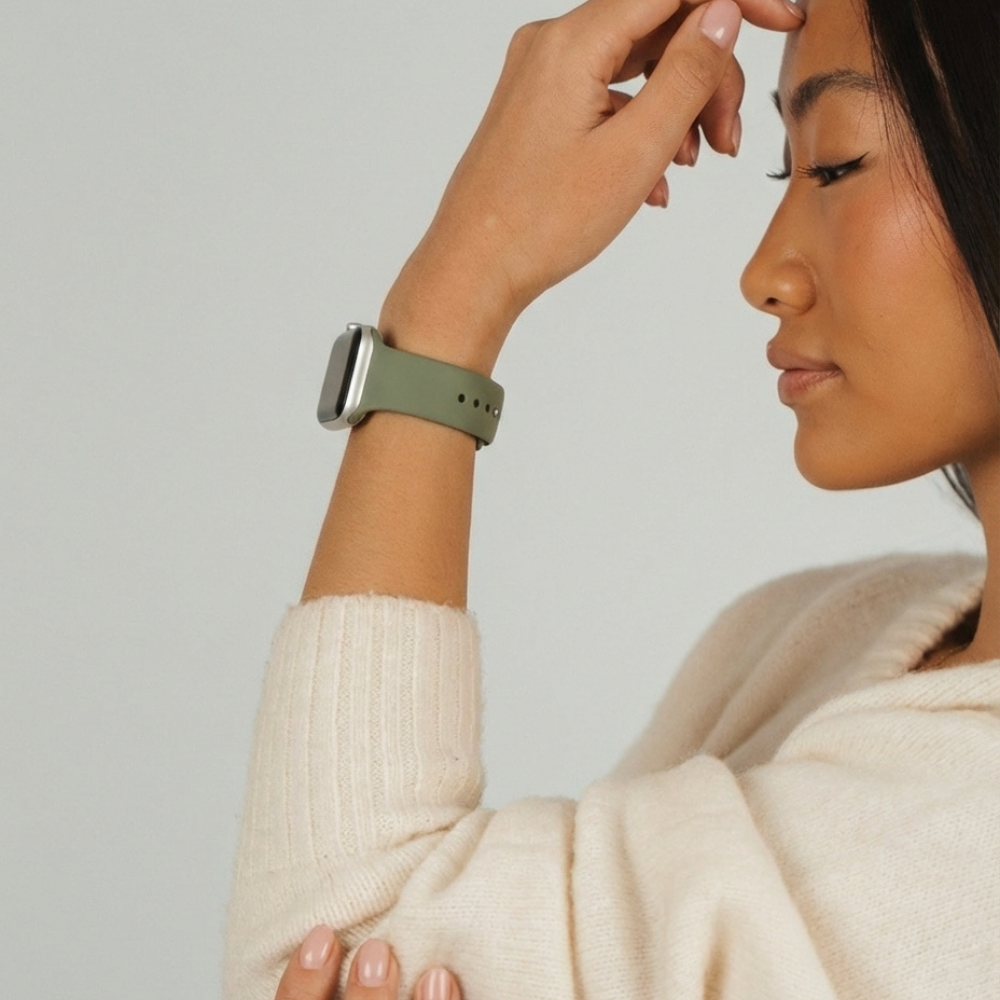 Girl posing in studio wearing the vintage khaki apple watch strap