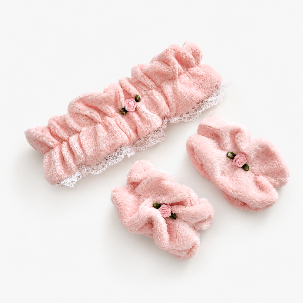 Pink pointelle fabric headband and wristbands with white lace trim detailing.