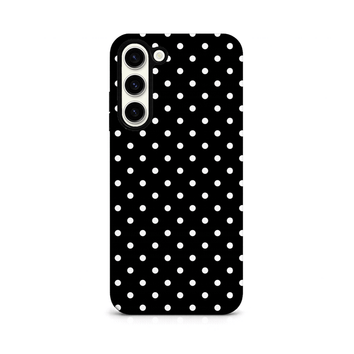 Phone case with black and white polka dot pattern on a white background.