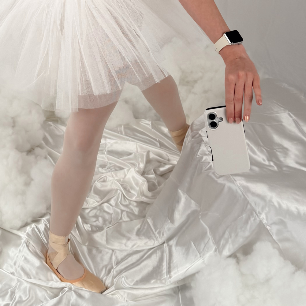 Ballet pose holding the Tough Cloud Dancer Phone Case