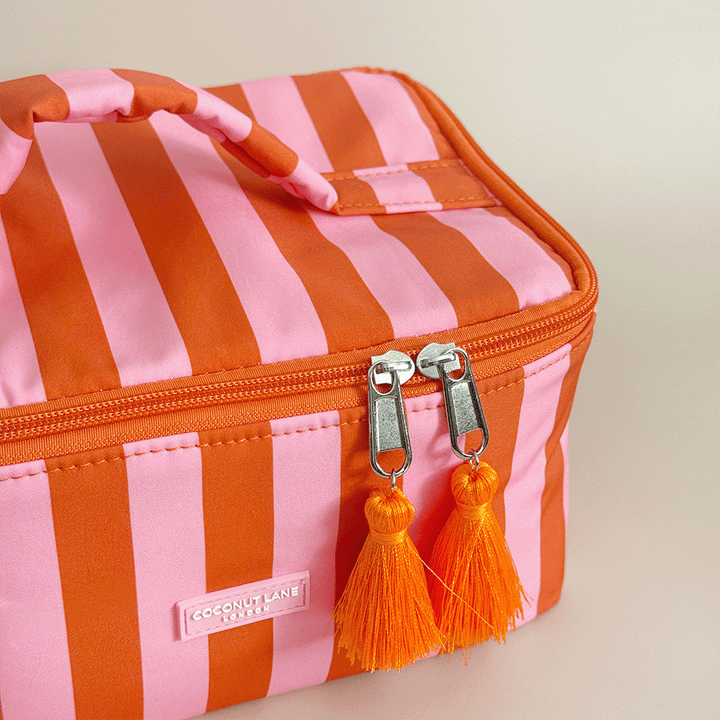 Orange and pink stripe Vanity Case, with tassels and padded handle.