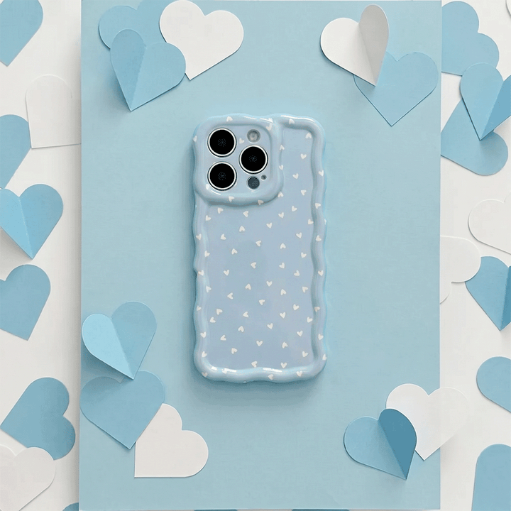 Wavy Phone Case with blue background and white hearts design. 