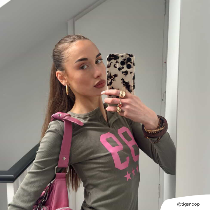 Girl taking mirror selfie with the Wavy Ivory Tort Phone Case