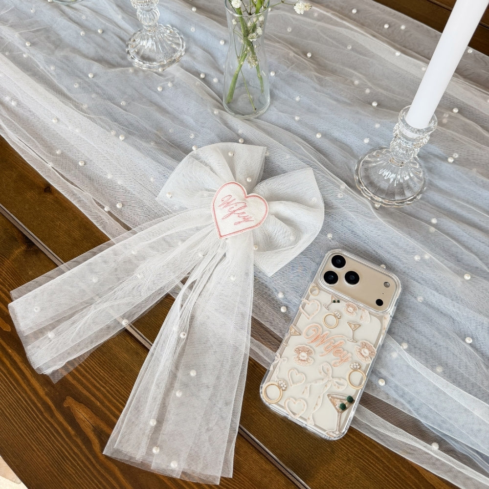 Wifey hair bow next to wifey phone case