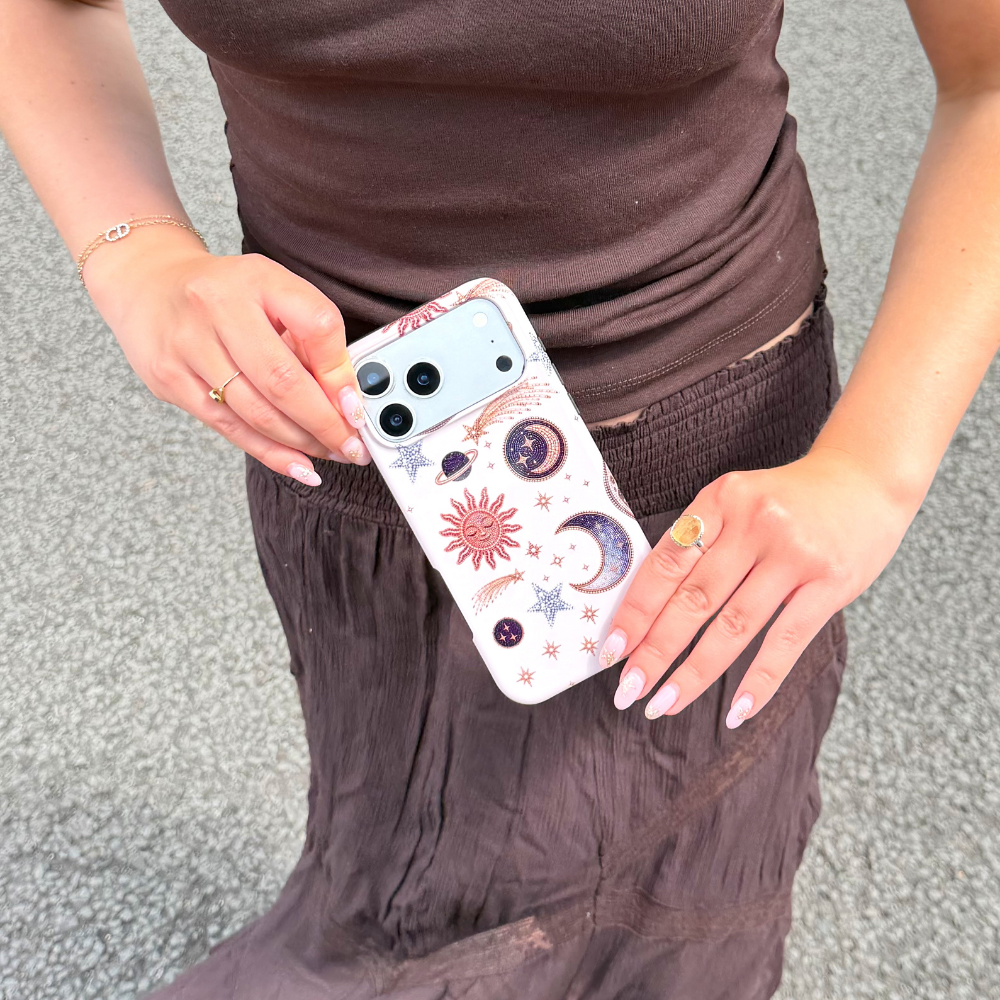 Girl in brown outfit holding the Tough After Dark Phone Case