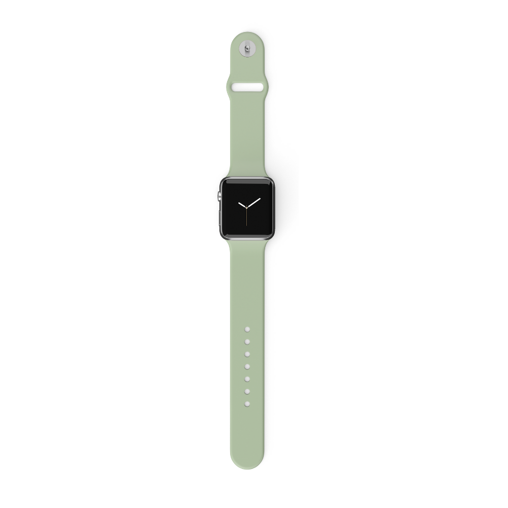 A NAKD Apple Watch Strap - Sage Green from Coconut Lane is displayed against a white background. The strap, which is light green silicone with several adjustment holes, is laid flat in an unfastened position.