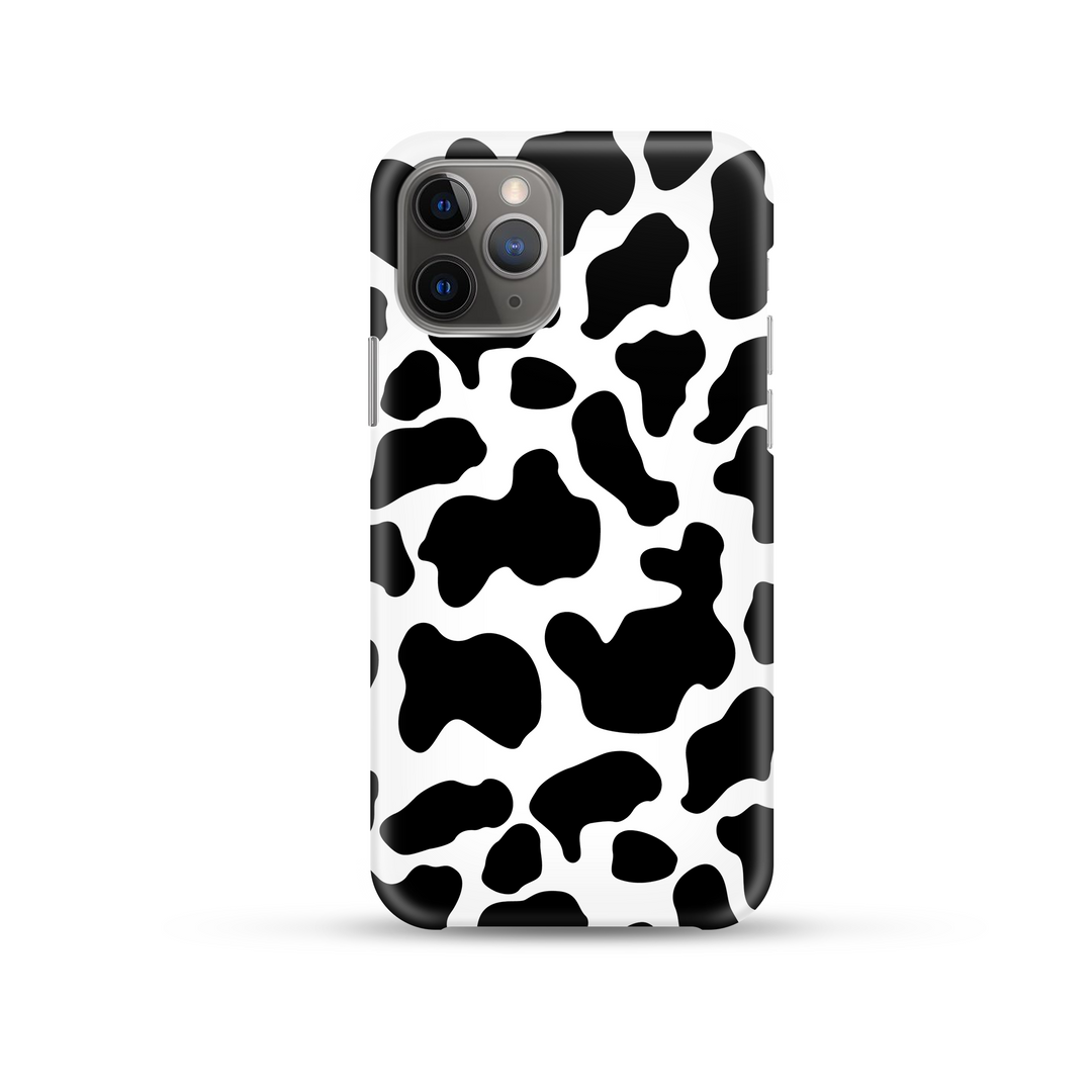 black and white cow print phone case on a white background